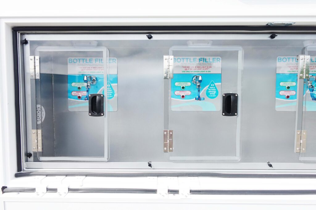 On-Site Hydration Services Signature Series water station trailer fill valves staged at a film production base camp