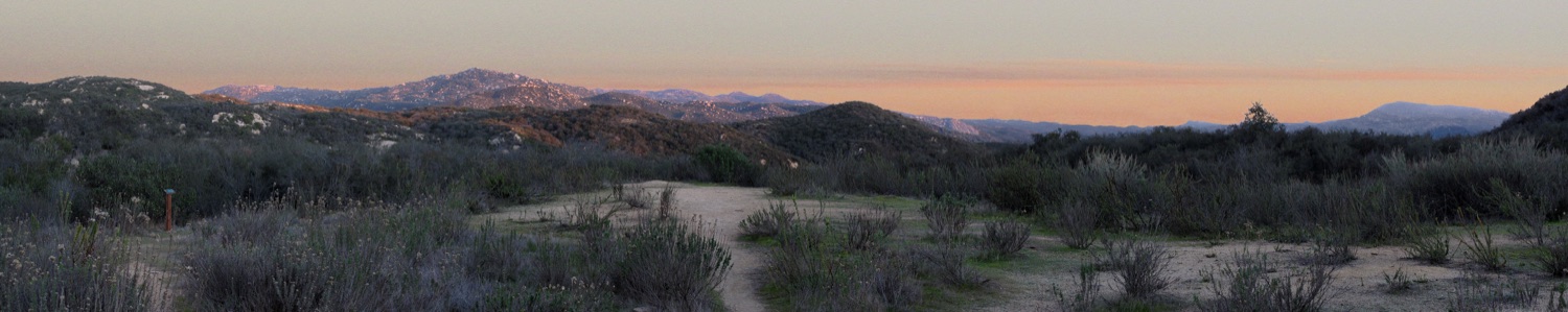 Dry chaparral hills and back country ridgelines around Daley Ranch in Escondido at dusk, classic Santa Ana fire-country terrain