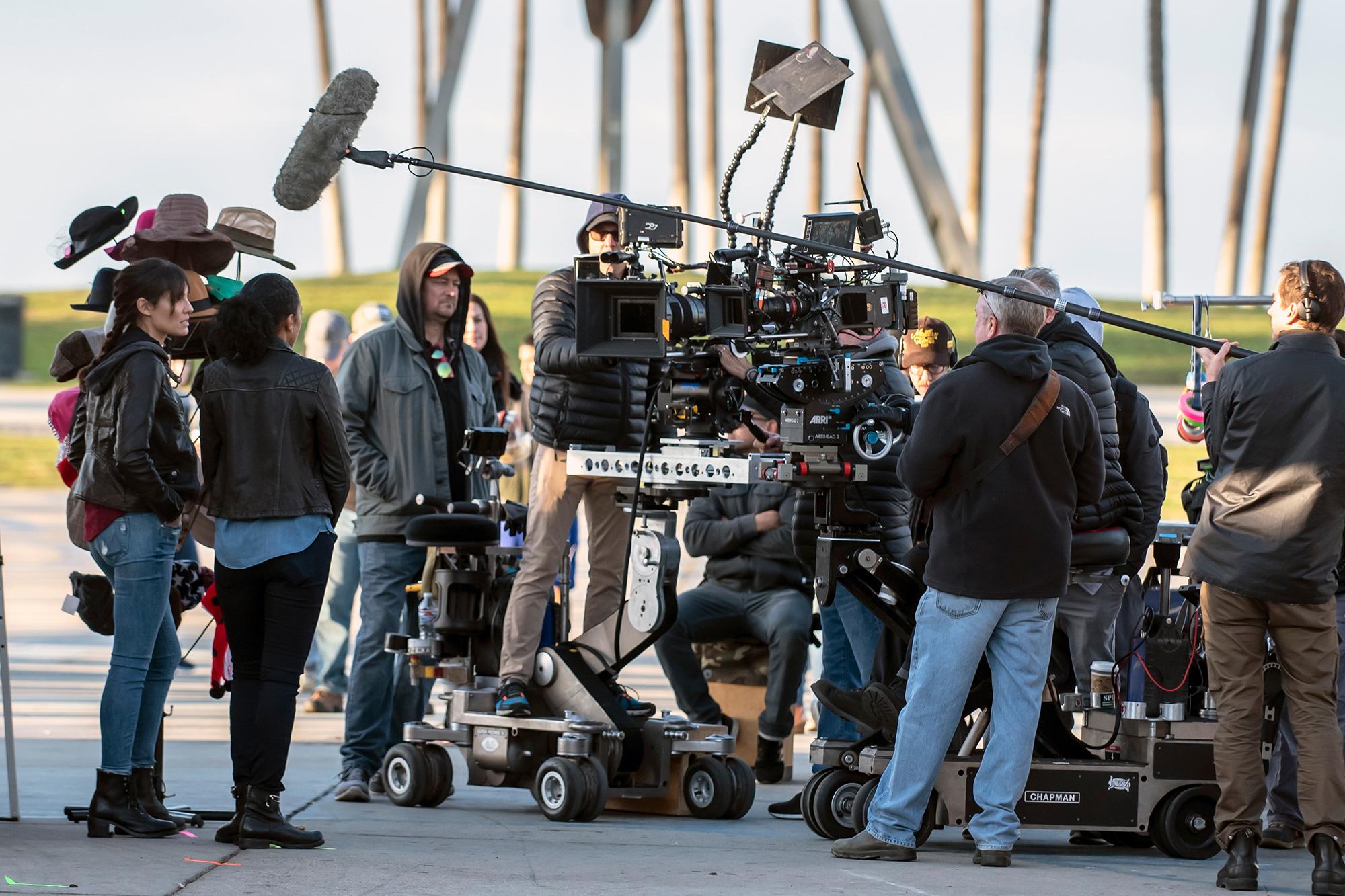 Film production camera crew working outdoors on a Los Angeles area location shoot