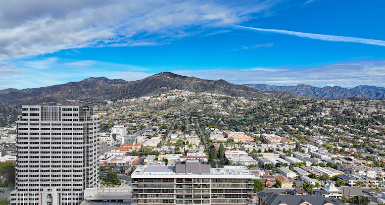 View of downtown Glendale California with the Verdugo Mountains rising behind the skyline