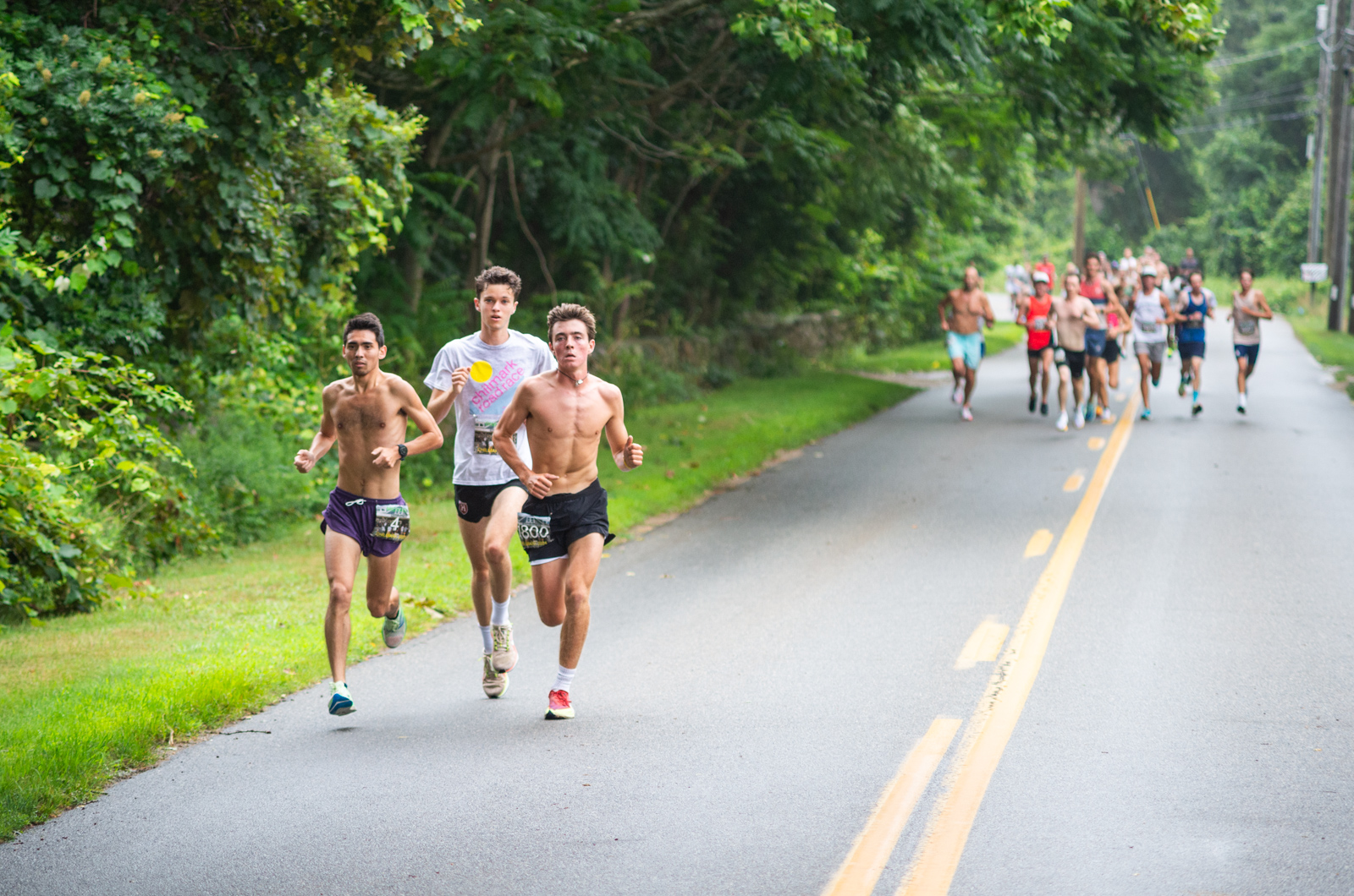 Runners on an outdoor Inland Empire road race served by mobile drinking water refill stations