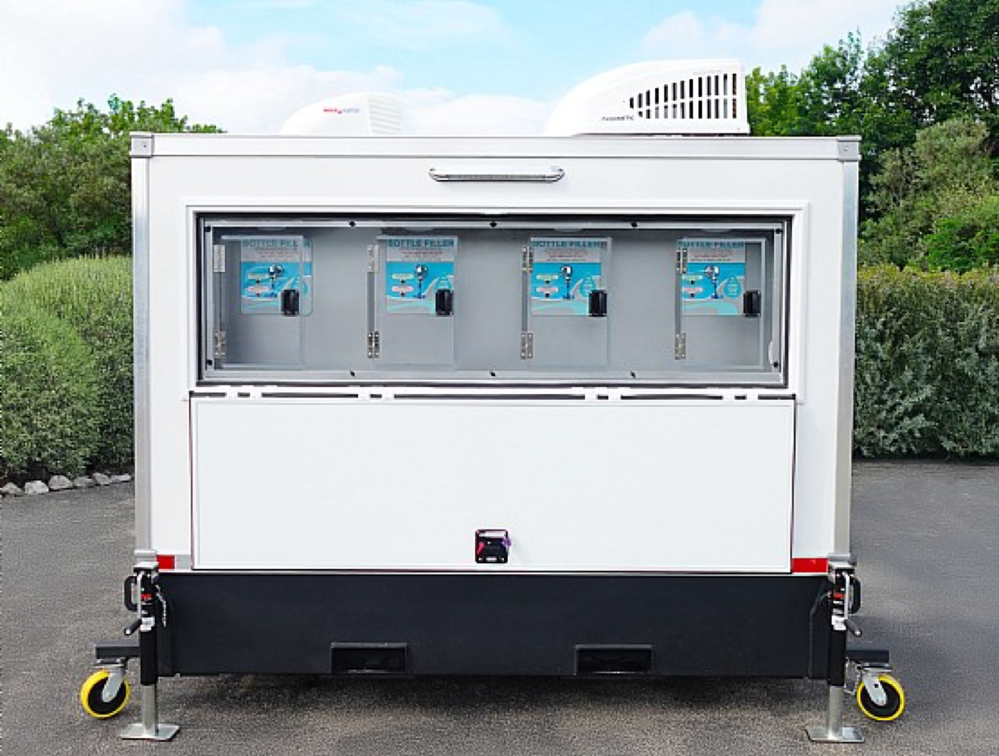 Signature Series mobile water station trailer with four bottle filling stations, staged for a Pomona job site or event
