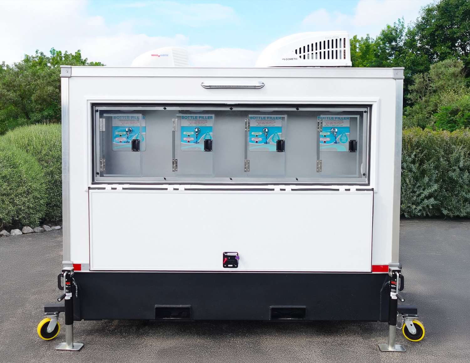 Signature Series mobile cold water station trailer with four bottle filling stations, staged for a Sunnyvale tech-campus event or construction site