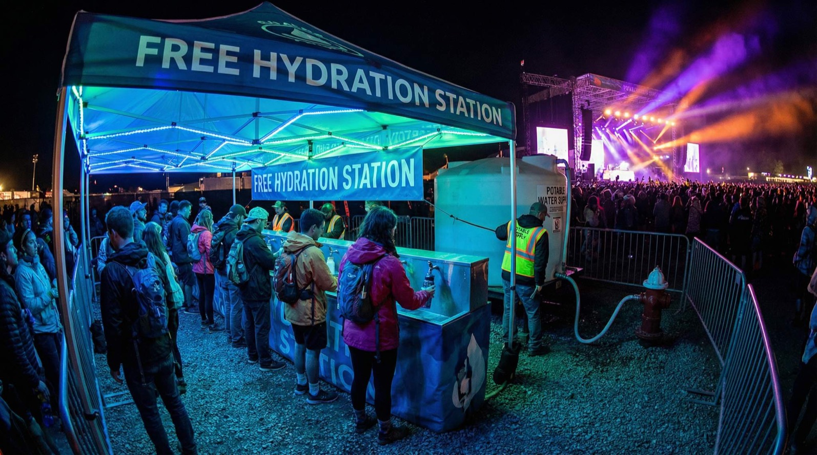 Large outdoor festival crowd in the Arizona sun near downtown Chandler served by mobile hydration stations