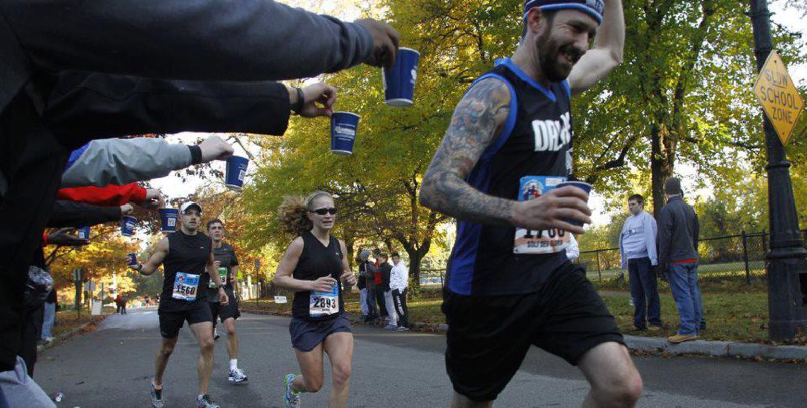 Outdoor race crowd refilling at a cold drinking water station near Chandler