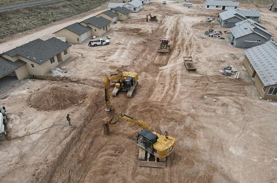 Desert jobsite under construction near Mesa where crews work in extreme heat and need documented cold-water access