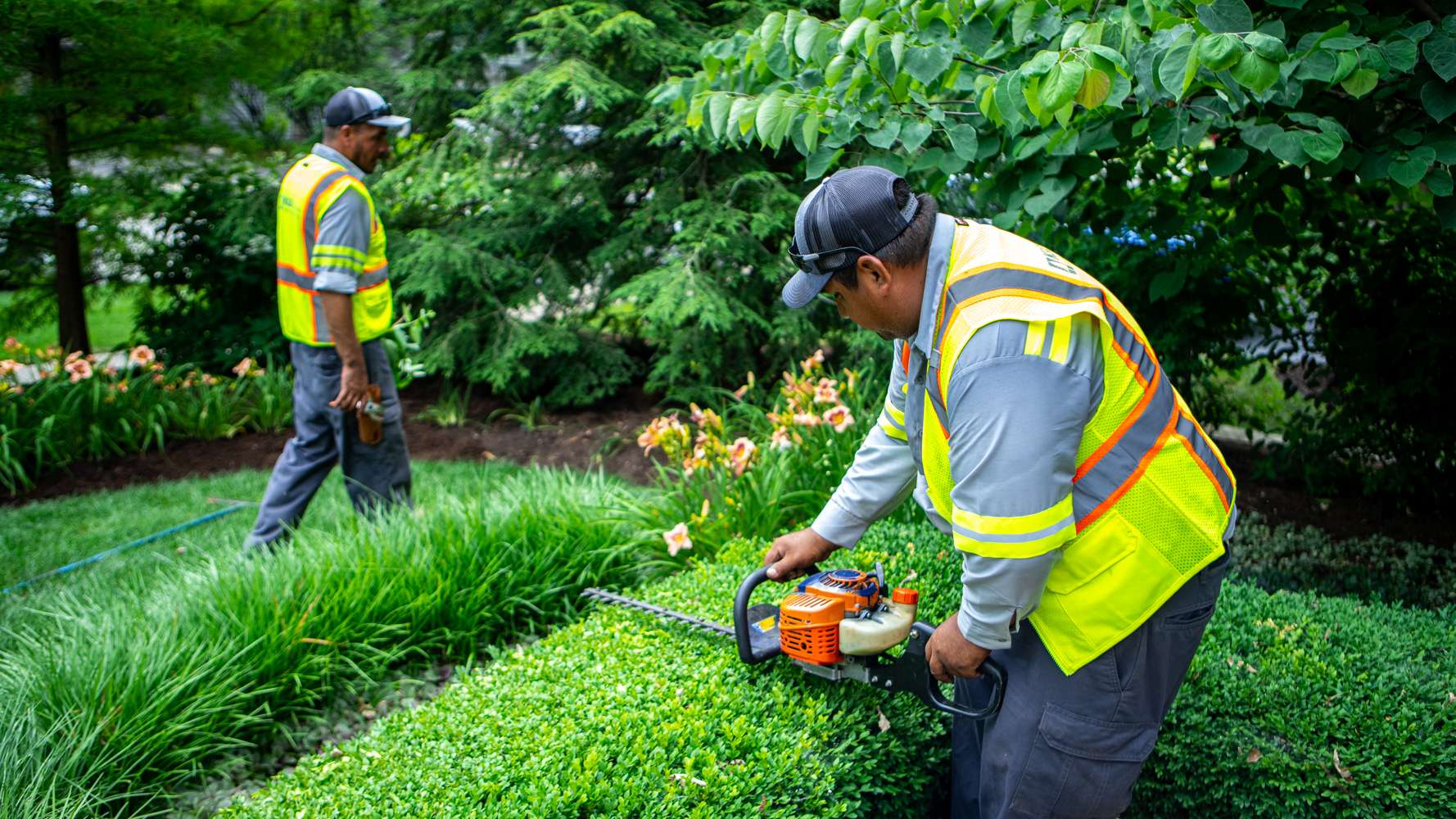 Outdoor landscaping crew working through Phoenix heat with on-site cold water access