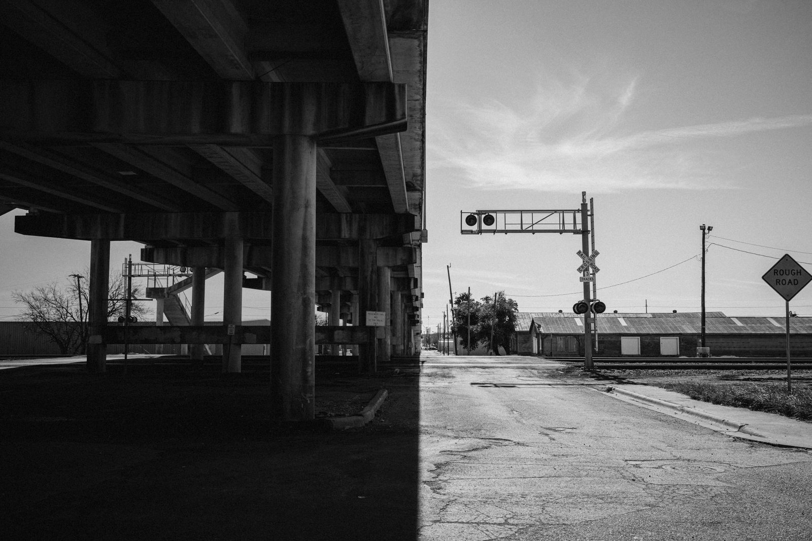 Highway underpass and rail crossing in an industrial corridor